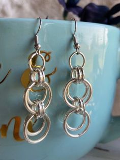 Gorgeous double jump ring drop dangle on a fish hook style ear wire. Drops to just over 2 inches. Comes in silver only. Chainmaille Jewelry Patterns, Chainmail Armor, Jump Ring Jewelry, Earring Inspo, Chainmaille Jewelry, Diy Beading, Earrings Ideas, Chain Maille Jewelry, Bead Ideas