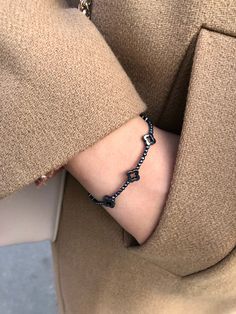 "This delicate and dainty bracelet is made of Genuine black Hematite. Bracelet looks very beautiful, unusual and just perfect for everyday wear as for special occasions. Cloverleaf is well known as a symbol of St. Patrick's Day, shamrock clover mean hope, faith, luck, and love. . ❗️Sign up to our Newsletter and get 15% OFF your order (copy this link to browser search) - https://forms.gle/R74xLdL1MSmC9Apn6 ❗️ . 🔸 MEASUREMENTS🔸 ▪️ Gemstones: Hematite ▪️ Beads size: 2 mm, 6 mm (Cloverleaf) ▪️ Cla Elegant Black Chain Bracelet With Adjustable Chain, Elegant Black Bangle Charm Bracelet, Elegant Black Bracelet With Adjustable Chain, Elegant Black Beaded Bracelet With Adjustable Chain, Elegant Black Charm Bracelet For Gift, Elegant Black Chain Bracelet As Gift, Elegant Black Adjustable Chain Bracelet, Black Charm Bracelet With Adjustable Chain, Black Metal Bangle Charm Bracelet