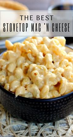 a bowl filled with macaroni and cheese on top of a table