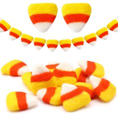 a bunch of candy corn on a white background