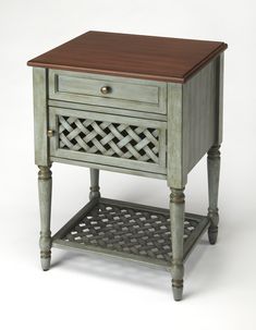 a small wooden table with drawers on one side and a drawer on the other end