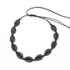 Matt Black Shell Choker I MCHARMS Casual Black Jewelry For Vacation, Adjustable Cowrie Shell Choker For Vacation, Trendy Black Jewelry For Vacation, Trendy Adjustable Choker For Vacation, Adjustable Trendy Choker For Vacation, Adjustable Length Choker For Beach, Black Bohemian Choker With Adjustable Cord, Black Casual Necklace With Adjustable Cord, Bohemian Style Black Choker With Adjustable Cord