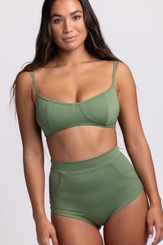 Seamless Nylon Swimwear For Water Sports, Stretch Swimwear With Pockets For Beach, Solid Nylon Swimwear For Water Sports, Sporty Nylon Swimwear With Padded Cups, Nylon Tankini For Water Sports Beachwear, Nylon Tankini For Water Sports, Sporty Solid Contoured Swimwear, Sporty Contoured Solid Swimwear, Stretchable Beachwear Swimwear With Pockets