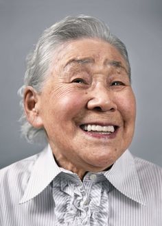 an older woman smiling with her eyes closed