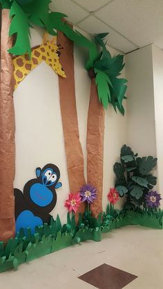 an office cubicle decorated with jungle animals and trees