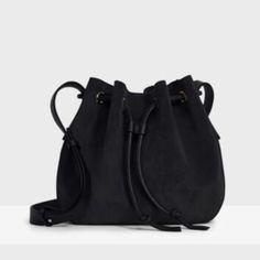 This Small Iteration Of The Classic Bucket Bag Is Designed With Adjustable Flat Crossbody Straps And Cinched With Tubular Drawstring Straps For Carrying Cross-Body Or On The Shoulder. It’s Carefully Crafted In Italy From Supple Suede In A Structured, Take-Anywhere Silhouette And Finished With A Microfiber Lining. Fit 3.7” (9.5 Cm) D X 9.8” (25 Cm) W X 9.5” (21.5 Cm) H Composition 100% Cow Leathercare Professional Leather Clean Only. Made In Italy. Small Bucket Bag, Brown Leather Clutch, Small Buckets, Blue Tote Bag, Drawstring Bucket Bag, Brown Leather Handbags, Denim Tote Bags, Denim Tote, Purple Suede