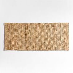 an area rug made out of jute on a white surface with no one in it