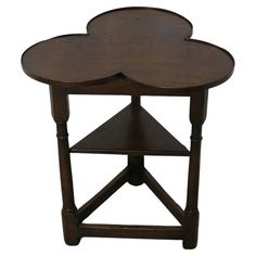 a wooden table with a flower shaped top