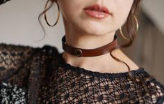 Introducing our captivating "Minimalist Leather Choker" - a stylish and versatile accessory that exudes timeless charm. Handcrafted with meticulous attention to detail, this choker is designed to elevate your style and add a touch of sophistication to any outfit. Made from premium quality Italian leather, this choker boasts durability and comfort, ensuring it remains a cherished piece for years to come. This "Minimalist Leather Choker" features a sleek and minimalistic design, making it suitable for various occasions. Whether you're dressing up for a special event or adding a chic flair to your everyday ensemble, this choker effortlessly blends with your wardrobe, making it a must-have accessory. Adjustable to your desired length, this choker ensures a perfect fit, and the secure fastening Chic Handmade Choker As Gift, Chic Handmade Choker For Gift, Trendy Adjustable Choker For Formal Occasions, Adjustable Trendy Choker For Formal Occasions, Trendy Adjustable Choker As Fashion Accessory, Chic Handmade Adjustable Choker, Minimalist Adjustable Choker, Handmade Choker For Everyday Use, Chic Handmade Leather Jewelry