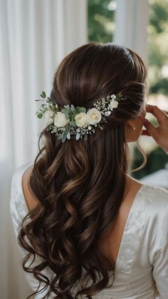 a woman with long hair wearing a flower crown