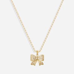 Shine bright with our Iced Bow Necklace! Made with 18k gold plating, this necklace features a charming bow design and sparkling cubic zirconia accents. Elevate any outfit with a touch of elegance and playfulness. * Colour - Gold * Made with luxury 18k Gold plated Stainless Steel * Chain Length: 40-45cm (16-18in) Chic Cubic Zirconia Necklace For Gifts, Party Jewelry With Diamond Bow, Party Diamond Bow Jewelry, Gold Bow Necklace For Party, Gold Necklace With Bow For Party, Cubic Zirconia Bow Jewelry Gift, Cubic Zirconia Jewelry With Bow For Gift, Cubic Zirconia Jewelry With Bow As Gift, Gold Plated Bow Jewelry For Party