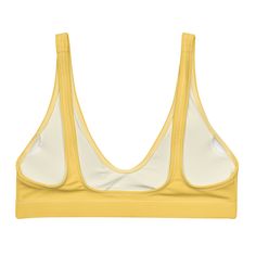 The bright yellow bralette bikini top is your go-to for everything under the sun and in saltwater. This women's swimsuit top is made with recycled fabric and crafted with light support. Features a deep v-neck. • 81% REPREVE recycled polyester, 19% LYCRA XTRALIFE • Fabric weight 7.52 oz • Double-layered and non-reversible • Removable padding • Tear-away care label • Zig-zag stitching Size guide CHEST WAIST HIPS XS (inches) 33 ⅛ 25 ¼ 35 ⅜ S (inches) 34 ⅝ 26 ¾ 37 M (inches) 36 ¼ 28 ⅜ 38 ⅝ L (inches Summer Low-cut Sports Bra With Built-in Bra, Seamless Triangle Top Sports Bra, Summer Stretch Sports Bra With Padded Cups, Summer V-neck Sports Bra With Built-in Bra, Beachwear Triangle Crop Top With Adjustable Straps, Seamless V-neck Beach Bra, Seamless V-neck Bra For The Beach, Seamless V-neck Sports Swimwear, Poolside Triangle Top Sports Bra With Adjustable Straps