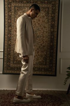 The ivory-layered ensemble exudes a graceful fusion of traditional and contemporary elements, with an unmistakable Indo-Western essence. Crafted from luxurious silk fabric, each layer of the ensemble is adorned with intricate tonal silk thread embroidery, adding an exquisite touch of elegance and sophistication.The ensemble features a stylish kurta with a modern twist, boasting a silhouette that effortlessly blends Eastern and Western influences. The fine embroidery enhances the allure of the ku Indowestern Outfits For Men, Kurta And Pants, Silk Thread Embroidery, Stylish Kurta, Fine Embroidery, Simple Kurti Designs, Wedding Outfit Men, Contemporary Elements, Summer Romance