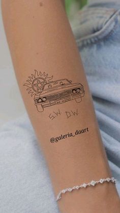 a woman's arm with a tattoo on it that has a car drawn on it