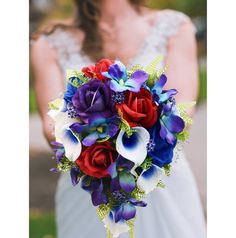 a bride holding a bouquet of red, white and blue flowers