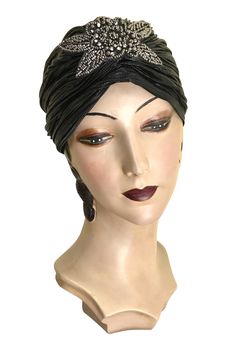 Made of a luxurious stretch black lamé with a beautiful vintage beaded appliqué. One size fits all. Fitted Flapper Headpieces For Evening, Fitted Flapper Style Headpiece For Evening, Fitted Flapper Style Evening Headpieces, One Size Black Turban For Party, Fitted Black Headpiece For Vintage Events, Elegant Black Adjustable Turban, Elegant Black Headwrap Headband, Adjustable Traditional Black Headwrap, Vintage Black Headband For Party