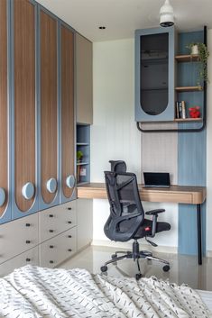 an office chair sitting in front of a desk