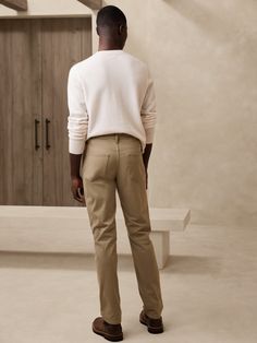 We updated our best-selling Traveler pant, keeping the same high-stretch comfort, but adding a more pronounced twill texture to the fabric.  Slim fit: Mid-rise.  Slim leg.  14" leg opening.  Organic: Made with certified, organically grown cotton that's easier on the earth.  Fabric from Italy's Olimpias mill.  Zip fly with button closure.  Belt loops.  Five-pocket styling.  Slim fit: Mid-rise.  Slim leg.  Leg opening: 14" Inseams: Short 30", Regular 32", Long 34" Model: Size 32x32, 6'2" (188cm). Solid Stretch Pants With Five Pockets, Beige Slim Fit Straight Leg Bottoms, Stretch Pants With Five Pockets And Tapered Leg, Slim Fit Straight Pants For Fall, Slim Fit Pants With Straight Hem For Fall, Stretch Straight Leg Chinos With Five Pockets, Slim Fit Straight Bottoms For Fall, Khaki Bottoms With Five Pockets For Fall, Beige Straight Leg Bottoms