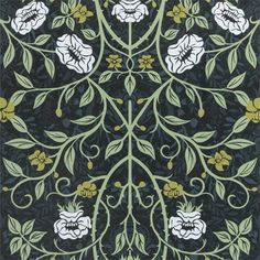 an intricately designed rug with flowers and leaves on black, yellow and green colors