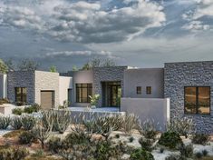 an artist's rendering of a house in the desert with cactus and rocks around it