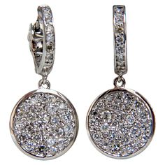 Circular diamond dangle earrings. 1.50cts of natural round diamonds: G-color, Vs-2 clarity. 14kt. white gold 6.3 grams. Earrings measure: 1 Inch Length .50 inch diameter (circle) .50 inch diameter (hoop) Comfortable lever closure $6,000 Appraisal Certificate to accompany Round Platinum Earrings With Pave Setting, Platinum Round Earrings With Pave Setting, Gia Certified White Gold Dangle Diamond Earrings, Gia Certified Dangle White Gold Diamond Earrings, Gia Certified Dangle Diamond Earrings In White Gold, Double Diamond, Diamond Dangle Earrings, Circle Diamond, Diamond Drops