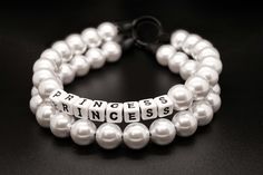 three bracelets with white pearls and words that say princess, princess on each strand