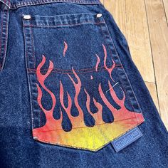 1990s Vintage SNAKE EYES Flared Wide Leg Y2K Rave FLAME Jeans Size 30". WOWIE! These pants scream "take me back to the 90s!", and I would gladly join them! Relive the glory days with this absolutely fabulous flared denim! Snake Eyes don't come around often, so add them to your collection while you can!  Era: 1990s Features: Fraying at bottom of legs, cool painted flame on bum, red stitching  Condition / Wear / Flaws: Wonderful vintage condition, no noticeable flaws; item has been washed and steamed and ready to wear  Size: Medium  Measurements laying flat: Waist- 30" Inseam- 26" Top to Bottom- 37" Fly- 12" Please take a moment to read our shipping and policies section before ordering. We have been selling vintage for over 29 years. We are careful to select only quality items in wearable co Airbrushed Jeans, Airbrush Jeans, Flame Jeans, Rhinestone Ideas, Rave Jeans, Paint Jeans, Custom Jeans Diy, Back To The 90s, Fashion Drawing Sketches