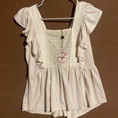 Beautiful Cream Sleeveless Top With Ruffles Nwt! Size M Casual Beige Vest Top, Sleeveless Beige Top For Day Out, Beige Sleeveless Top For Day Out, Beige Vest Top For Vacation, Casual White Ruffled Tank Top, Casual Ruffled Tank Top, Casual Ruffle Tank Top, Casual Beige Tank Top For Day Out, Casual Ruffled Tank Top For The Beach