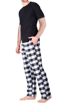 Slip into a restful slumber with this irresistibly cozy cotton-bend pajama set that features a short sleeve t-shirt and plaid flannel pants. 2-piece set Shirt has crewneck, short sleeves Pants feature button fly, drawstring waist, plaid pattern 55% cotton, 45% polyester Machine wash cold, tumble dry low Imported Model stats: 6'1" height, 32" waist. Model is wearing size M. Cozy Plaid Cotton Sleepwear, Plaid Cotton Sleepwear, Cotton Plaid Sleepwear For Loungewear, Plaid Cotton Sleepwear For Loungewear, Plaid Cotton Sleepwear For Bedtime, Cotton Plaid Sleepwear For Bedtime, Comfortable Plaid Cotton Sleepwear, Plaid Relaxed Fit Sleepwear For Loungewear, Casual Plaid Cotton Sleepwear