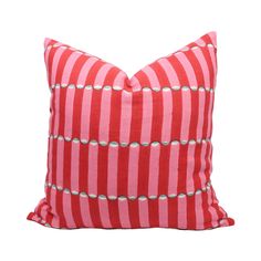 a red and white striped pillow on a white background