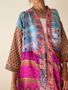 This is cute vintage style everyday shirt for aroun the house and outside as an lightweight over coat  Perfect for the beach, swimming pool or as an outside topper shirt  MEAESURE Size S/M UK 8-10  shoulders 17" bust 37" length 40 MATERIAL * saree silk  * no, lining Please visit also  https://www.etsy.com/shop/AltheaStores For more ideas CARE INSTRUCTIONS  * Wash in warm water * Hand wash recommended * Hang to dry  IMPORTANT NOTE  * Please note that colour shown on your monitor may vary from the Patchwork Long Sleeve Kimono For The Beach, Long Sleeve Patchwork Kimono For The Beach, Vintage Multicolor Kimono For The Beach, Vintage Multicolor Kimono For Beach, Multicolor Patchwork Kimono For The Beach, Multicolor Patchwork Kimono For Vacation, Multicolor Patchwork Kimono For Beach, Multicolor Patchwork Beach Kimono, Beach Patchwork Multicolor Kimono