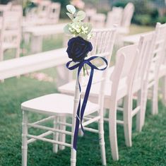 the chairs are decorated with flowers and ribbons