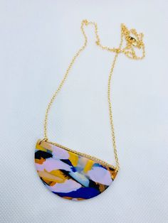 Handmade polymer clay necklace. Fixtures: 22ct gold-plated brass chain. Dimensions: chain length is 22 cm, pendant is 6 cm wide and 3 cm long. Gold Hand-painted Round Pendant Necklace, Unique Gold Polymer Clay Necklace, Multicolor Necklaces With Gold Chain For Gift, Gold Polymer Clay Pendant Necklace, Gold Pendant Necklace In Polymer Clay, Shrinking Violet, Gold Statement Necklace, Polymer Clay Necklace, Clay Necklace