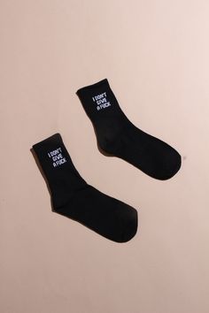 Make a major statement in these fun socks! These crew length socks are made in a stretchy cotton blend and feature "IDGAF" woven into a ribbed cuff. Available in Black or White Trendy Black Cotton Knee-high Socks, Black Stretch Cotton Knee-high Socks, Black Stretch Socks For Streetwear, Casual Cotton Letter Print Socks, Trendy Letter Print Cotton Socks, Trendy Black Socks With Letter Print, Trendy Cotton Letter Print Socks, Trendy Cotton Socks With Letter Print, Cotton Socks With Letter Print For Streetwear