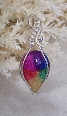 Beautiful and Unique 36 mm x 23 mm teardrop shaped rainbow Solar Quartz cabochon wrapped in sterling silver wire and beads. Multicolor Wire Wrapped Pendant Jewelry, Unique Wire Wrapped Teardrop Pendant Jewelry, Bohemian Teardrop Silver Plated Wire Jewelry, Bohemian Teardrop Silver Plated Jewelry, Iridescent Teardrop Gemstone Jewelry, Silver Teardrop Pendant With Beads, Silver Teardrop Pendant With Beaded Details, Silver Beaded Teardrop Pendant Jewelry, Silver Oval Beaded Jewelry