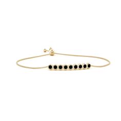 This elegant 14k yellow gold Natori bracelet features round black onyxes, arranged in a linear fashion. These black onyxes are secured in bezel settings within hexagonal frames. It is adjustable to fit most wrists. Polished Black Bracelets, Classic Adjustable Black Chain Bracelet, Timeless Adjustable Black Jewelry, Formal Black Diamond Bracelets, Black Diamond Bracelets For Formal Occasions, Modern Black Bracelets With Black Diamonds, Elegant Black Adjustable Chain Bracelet, Elegant Black Bracelet With Adjustable Chain, Modern Black Jewelry With Bezel Setting