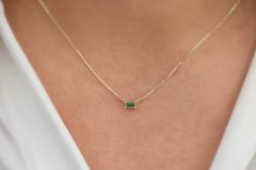 This necklace is made out of 14k solid gold with a stunning Genuine Natural green Emerald in the form of a baguette to give you a modern and mesmerizing look. The chain is adjustable in length, which makes it look lovely with any outfit. You will receive a certificate with the necklace.  Please keep into account that we use Natural Emerald, so there can be slight changes in color and cut. This makes each stone unique and one of a kind.  💎Design: Emerald Necklace 💎 Material: Solid 14k Gold and Emerald Baguette Necklace, Luxury Gold Baguette Cut Emerald Necklace, Small Emerald Necklace, 14k Gold Jewelry With Green Baguette Diamonds, Green 14k Gold Jewelry With Baguette Diamonds, Baguette Cut Emerald Necklace Gift, Gift Fine Jewelry Emerald Necklace With Baguette Diamonds, Emerald Baguette Cut Necklace For Gift, Baguette Necklace