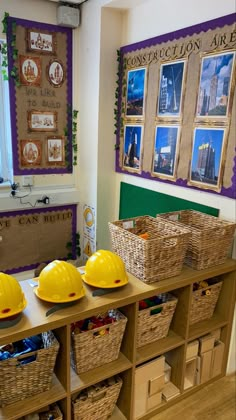 three yellow hard hats sitting on top of a wooden shelf next to baskets filled with construction materials