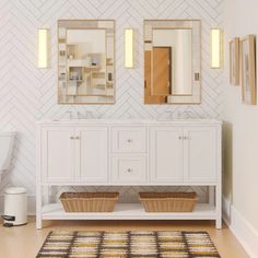 a bathroom with two sinks, mirrors and baskets on the floor in front of it