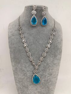 Doublet Light Blue Pendent CZ Necklace Statement Necklace Silver Finish. CZ Chain in sliver with light blue Doublet Stone. Perfect Statement Necklace Real Looking. Premium quality Satisfaction guaranteed. Necklace Length : 16 Inches; Earrings Length : 2 Inches; If you have any questions please let me know. Thank You!! Ready to ship from Boston, Massachusetts.