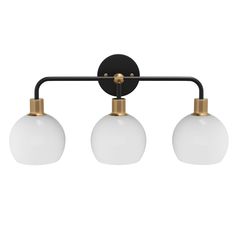 three light bathroom fixture with two white glass globes on an antique brass metal bar