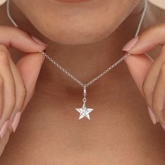 Give the gift of a lucky star with this sterling silver origami star charm necklace! This silver star charm has been crafted from recycled sterling silver and features smooth polished surfaces that reflects a high-quality shine. Inspired by the Japanese art of paper folding, known as origami, this 3d star has been designed to mimic folds of paper giving it a stunning geometric look.  All our charms attach with a clip-on clasp and are compatible with all other leading charm jewellery brands. Simp Elegant Silver Star Charm, Silver Charm Necklace With Star Charm, Silver Pendant Charm Necklaces With Star Charm, Silver Pendant Charm Necklace With Star Charm, Silver Star Charm Necklace, Silver Star Sterling Silver Charms, Sterling Silver Star-shaped Charms, Sterling Silver Star Charm Necklace For Everyday, Silver Star-shaped Sterling Silver Charms