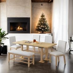 a dining room table with chairs and a christmas tree in the fireplace area behind it