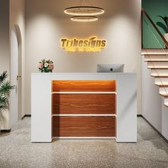 the reception desk is in front of stairs and a sign that says threshins