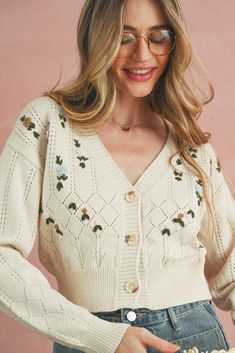 Spring V-neck Sweater With Button Closure, Spring V-neck Pointelle Knit Cardigan, Casual Cream Cardigan With Floral Embroidery, Cream Pointelle Knit Spring Cardigan, Casual V-neck Sweater With Floral Embroidery, Embroidered V-neck Knit Cardigan, Embroidered Knit V-neck Cardigan, V-neck Floral Embroidery Cardigan For Fall, Feminine Spring Cardigan With Pointelle Knit