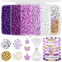 purple and white hair accessories in a plastic case with gold accents on the side, including beads