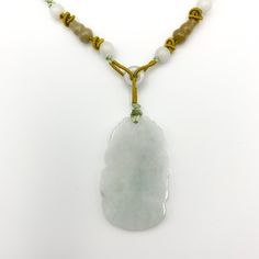 NATURAL JADE: This is a high grade jadeite jade necklace. It is exquisitely hand carved, so it is one of a kind! The pendant is completely natural jade, un-dyed and in its natural form. CARVING: The pendant is carved in the form of the Chinese Zodiac - Snake. JADE COLOR: Semi-Translucent white jade color with hints of light green gray. ADJUSTABLE NECKLACE: The necklace is adjustable - one size fits all! GIFT BOX: It comes with a gift box. Perfect for gifts! MINOR IMPERFECTIONS: The item is hand Handmade Jade Necklaces For Good Luck, Spiritual Single Strand Jade Necklace, Adjustable Jade Necklace, White Single Strand Jade Jewelry, Jade Amulet Necklace With Natural Stones, Adjustable Jade Necklace For Good Luck, Carved Jade Pendant Necklace, Carved Jade Jewelry For Good Luck, Snake Chinese Zodiac