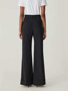 Featuring a high waist, sophisticated wide-leg silhouette, and chic cuff details, these trousers offer a polished and elegant look. High waist Wide-leg silhouette Chic cuff details 41% Wool, 52% Polyester, 4% Elastane, 3% Polyamide Dry Clean Only Chic Wide Leg Pants With Pressed Crease For Evening, Flared Wide Leg Pants With Pressed Crease For Work, Sleek Wide Leg Flare Pants For Evening, Sleek Flare Wide Leg Pants For Evening, Formal Wide Leg Flare Pants With Pressed Crease, Elegant Fitted Bottoms With Flared Cuffs, Classic Wide Leg Dress Pants For Party, Elegant Formal Pants With Flared Cuffs, Luxury Wide Leg Pants For Workwear With High Waist