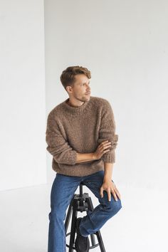 "This sweater is classic and never goes out of style, it's timeless. What makes this jumper exceptional? It is incredibly soft, warm and cozy, crafted from premium alpaca wool and silk.  DETAILS - Handmade. Our skillful knitters knit each garment by hand in their own homes and we are happy to provide them with the opportunity to support themselves while doing something they love. - Composition: alpaca wool and silk. No synthetic blends, for you and the environment. - Brown color. You can choose any other color listed in the last photo. - Regular fit. The model wearing size M and she is 184 cm/6\" tall. - Alterations are available. Please just let us know. - Orders are nicely packaged in tissue paper or cotton dust bags, and the option of a gift box with a satin ribbon is available to make Men’s Beige Sweater Outfit, Mens Jumper Outfit, Wool Sweater Men Outfit, Light Brown Sweater Outfit, Sweater Men Outfit, Minimalist Mens Fashion, Jumper Outfit Men, Knitted Jumper Outfit, Tall Men Fashion