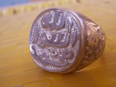 Religious Ring Prophet Mohammad Seal Allah Mohammad Rasool Real Sterling Silver Available in all sizes This ring is made with real precision and skill to give the look of the ancient Arabic words of Allah Mohammad Rasool. This ring is made in sterling silver 925 and polished with the latest polishing to avoid any scuffing. Please contact me in case of any questions. Traditional Carved Rings For Ceremonial Occasions, Traditional Carved Ceremonial Rings, Traditional Carved Engraved Wedding Ring, Traditional White Gold Engraved Ring, Traditional White Gold Engraved Ring With Polished Finish, Traditional Etched White Gold Rings, Traditional Silver Engraved Ring, Traditional Silver Engraved Ring With Polished Finish, Traditional Adjustable Engraved Ring For Anniversary